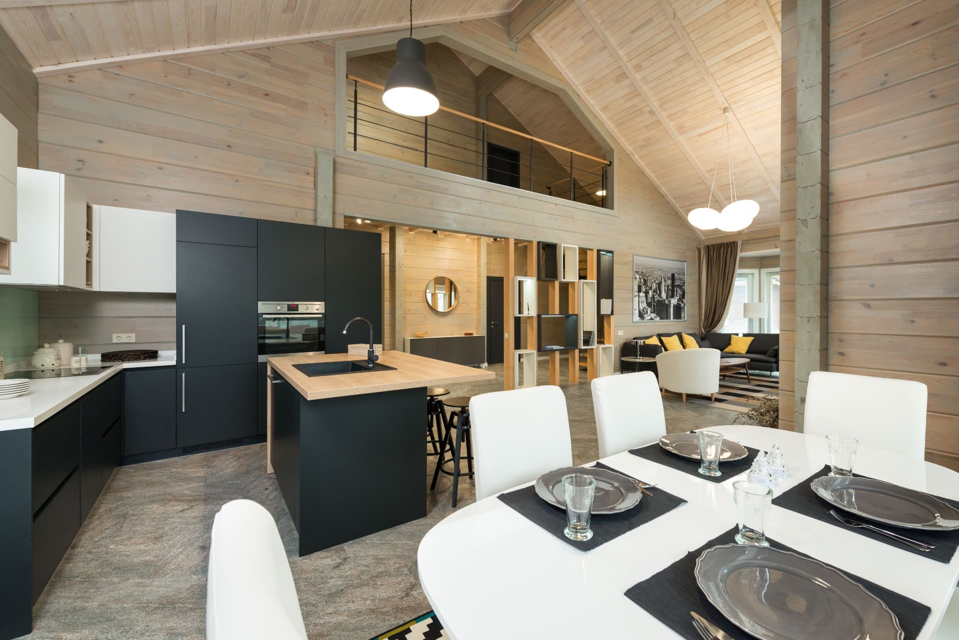 Vaulted timber kitchen and dining space with stone flooring