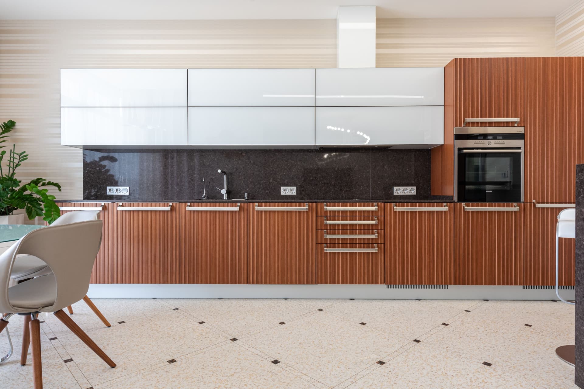 Chelsea Penthouse — fluted timber kitchen run with gloss lacquer wall units, London SW3