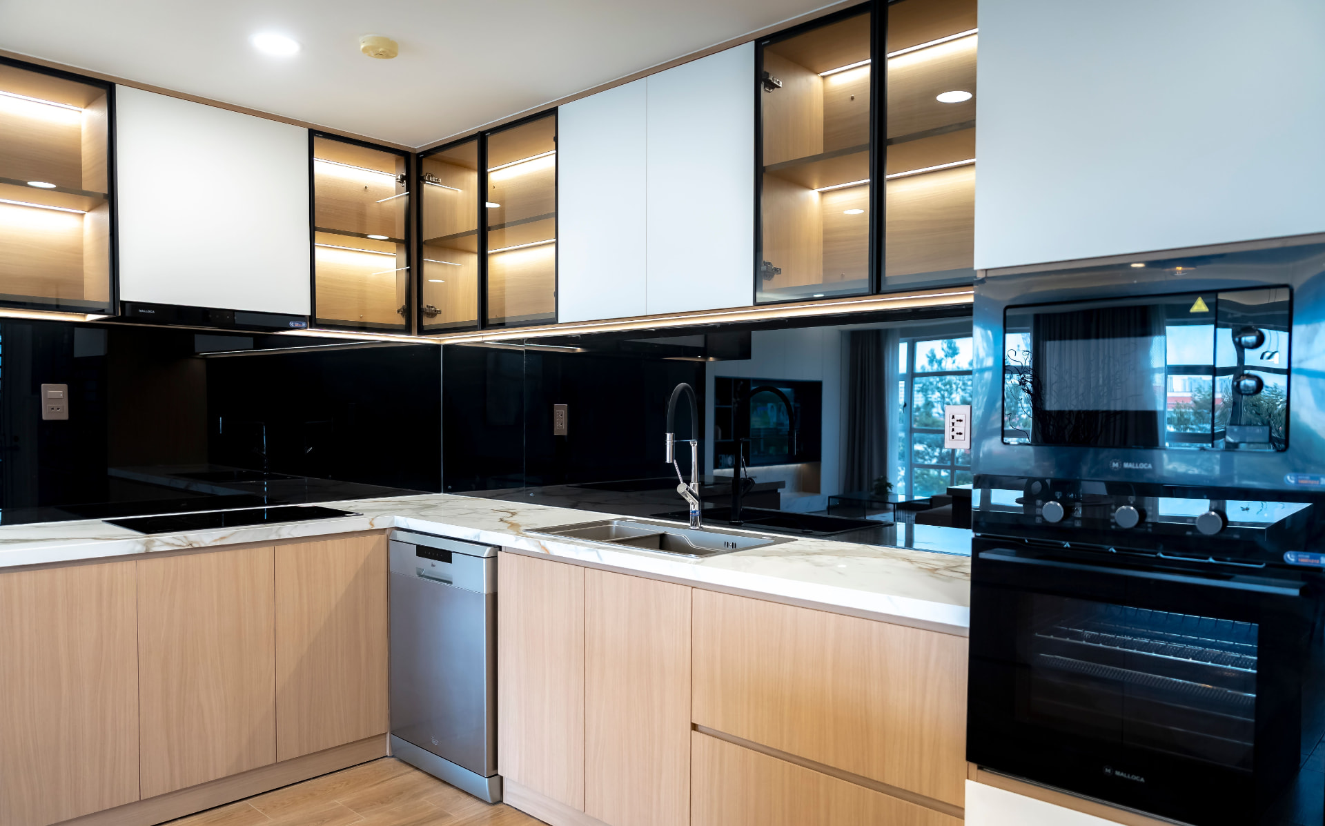 Hampstead Family Home — light oak kitchen with glazed lit cabinets and marble worktop, London NW3