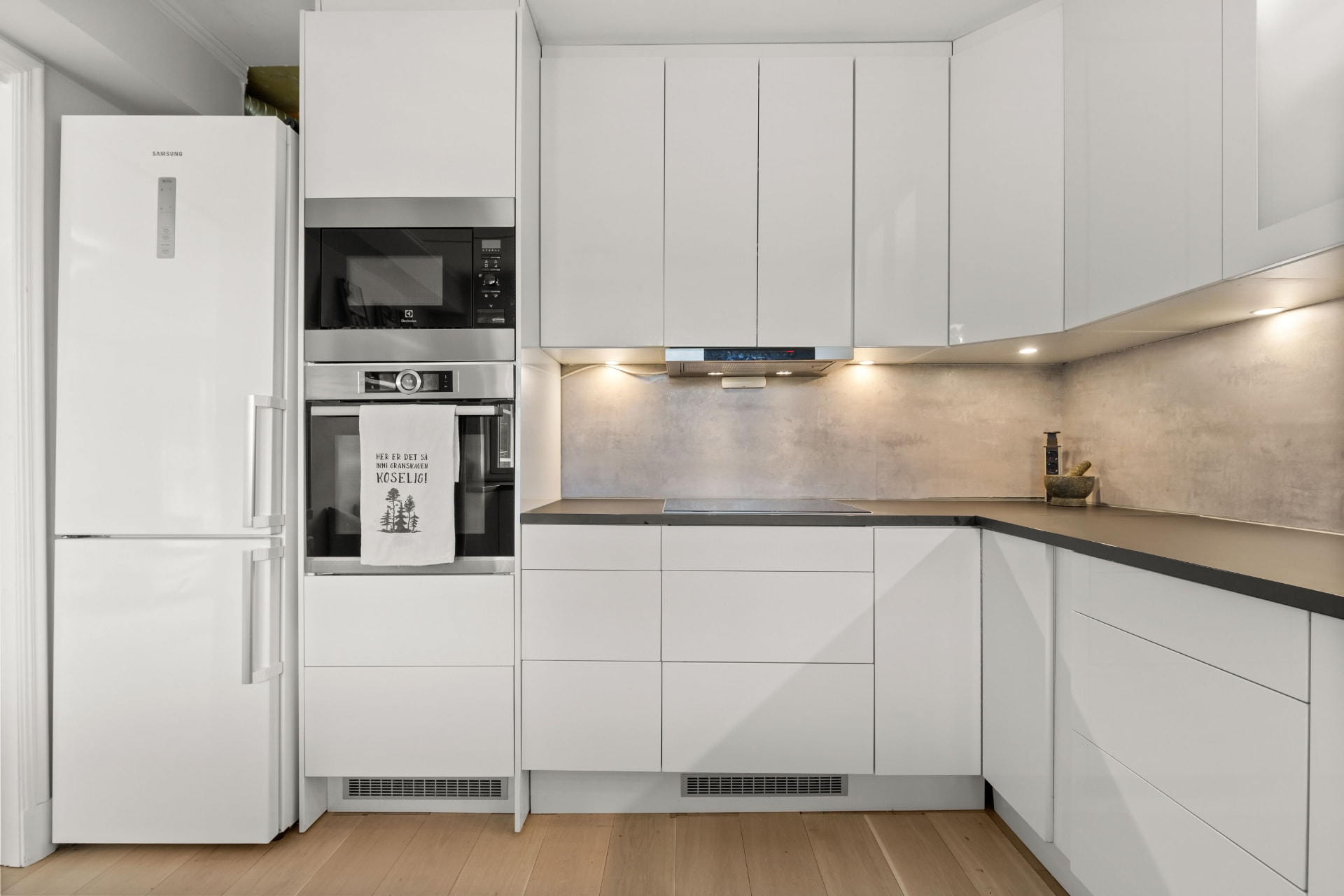 Fulham Pied-à-Terre — compact white gloss kitchen with integrated appliance tower, London SW6