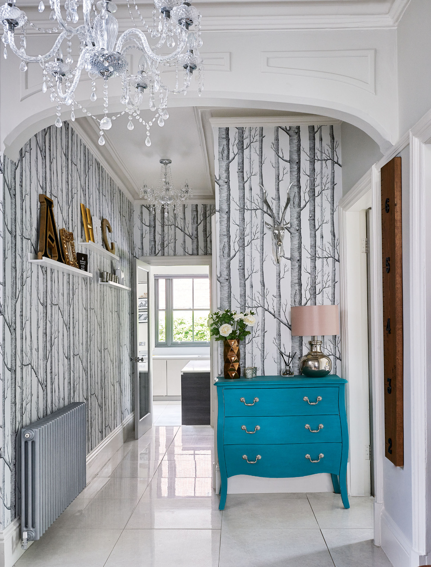 Victorian Villa — arched entrance hall with restored cornicing, chandelier and polished floor