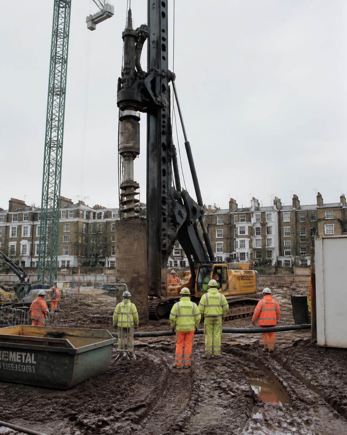 Piling rig installing secant piles on the urban London site