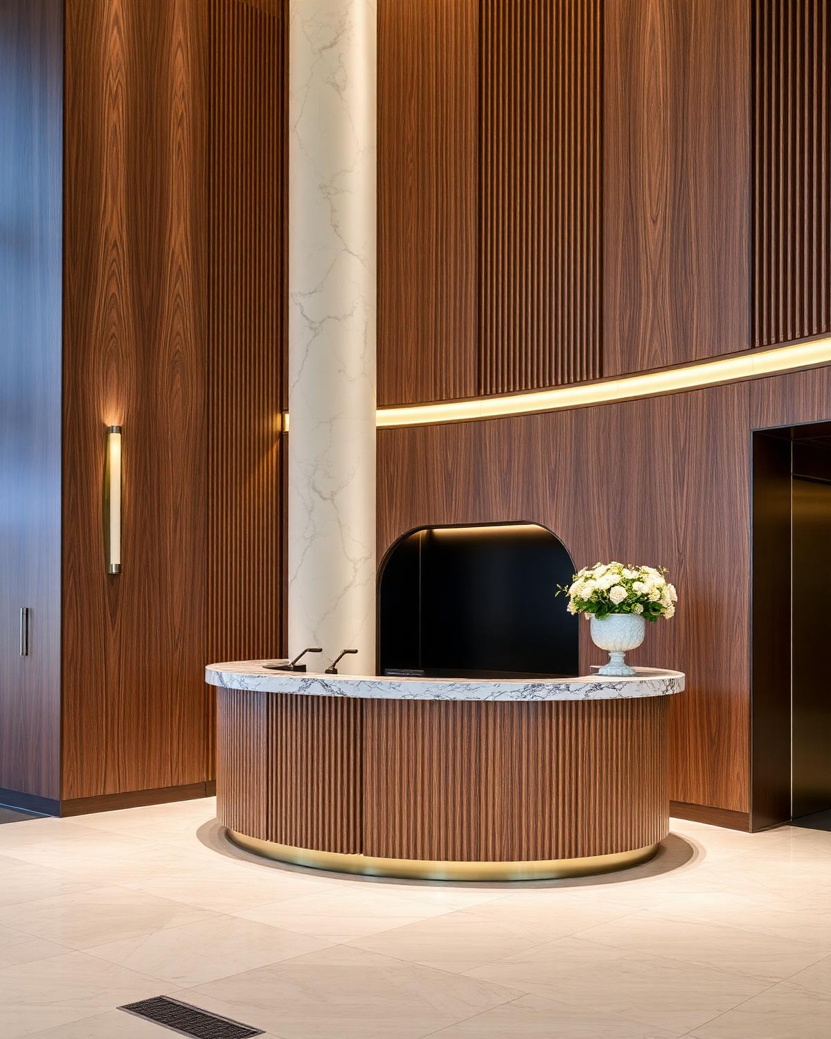 Curved fluted timber and marble reception desk