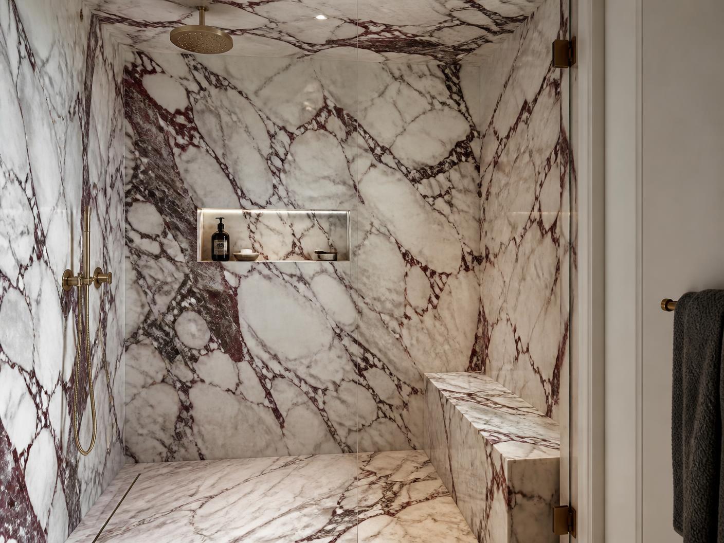 Breccia Capraia full slab wet room with carved stone bench