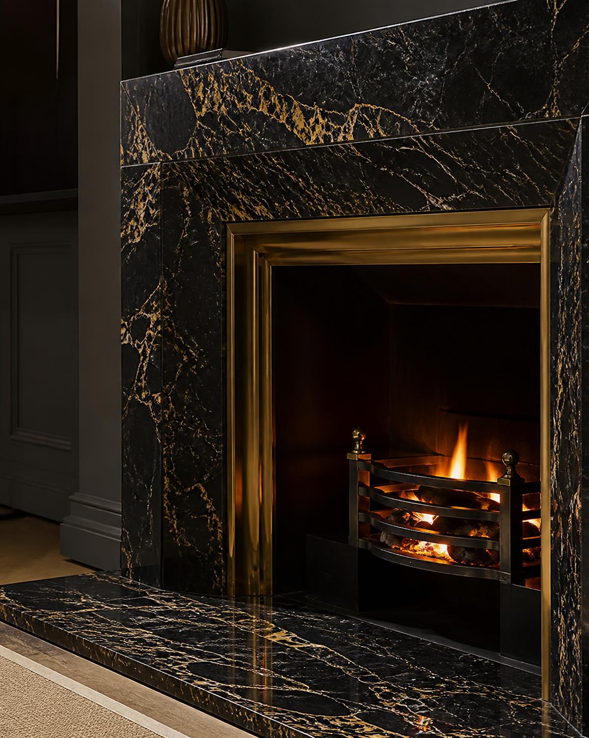 Detail of the Portoro hearth and polished brass fireplace reveal